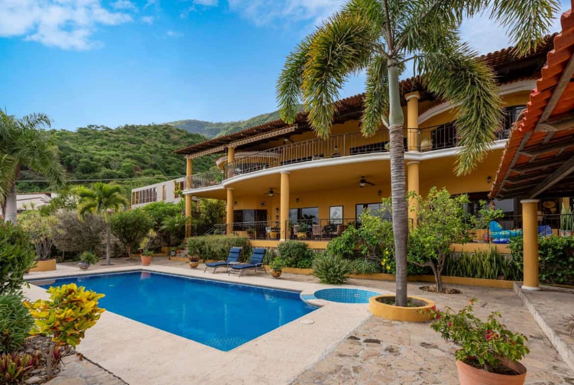 a pool in front of a house